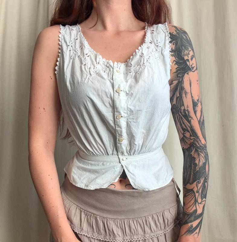 Cache corset blanc boutonné et détails fleuris ajourés – taille XS