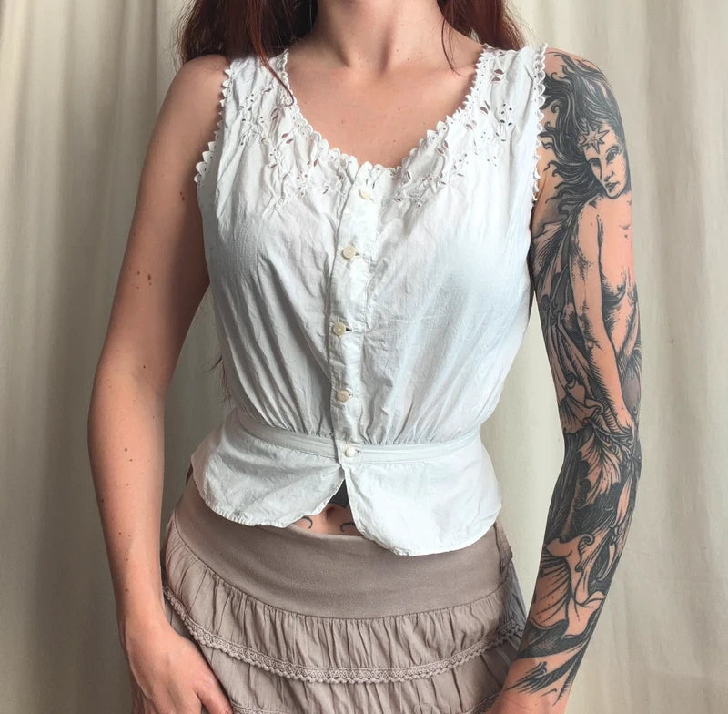 Cache corset blanc boutonné et détails fleuris ajourés – taille XS