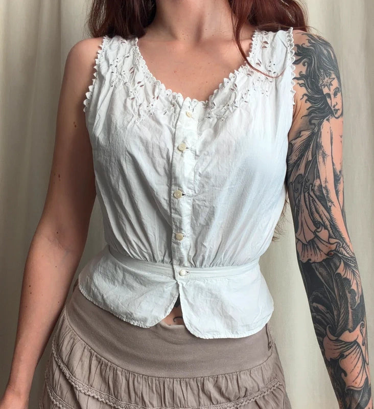 Cache corset blanc boutonné et détails fleuris ajourés – taille XS